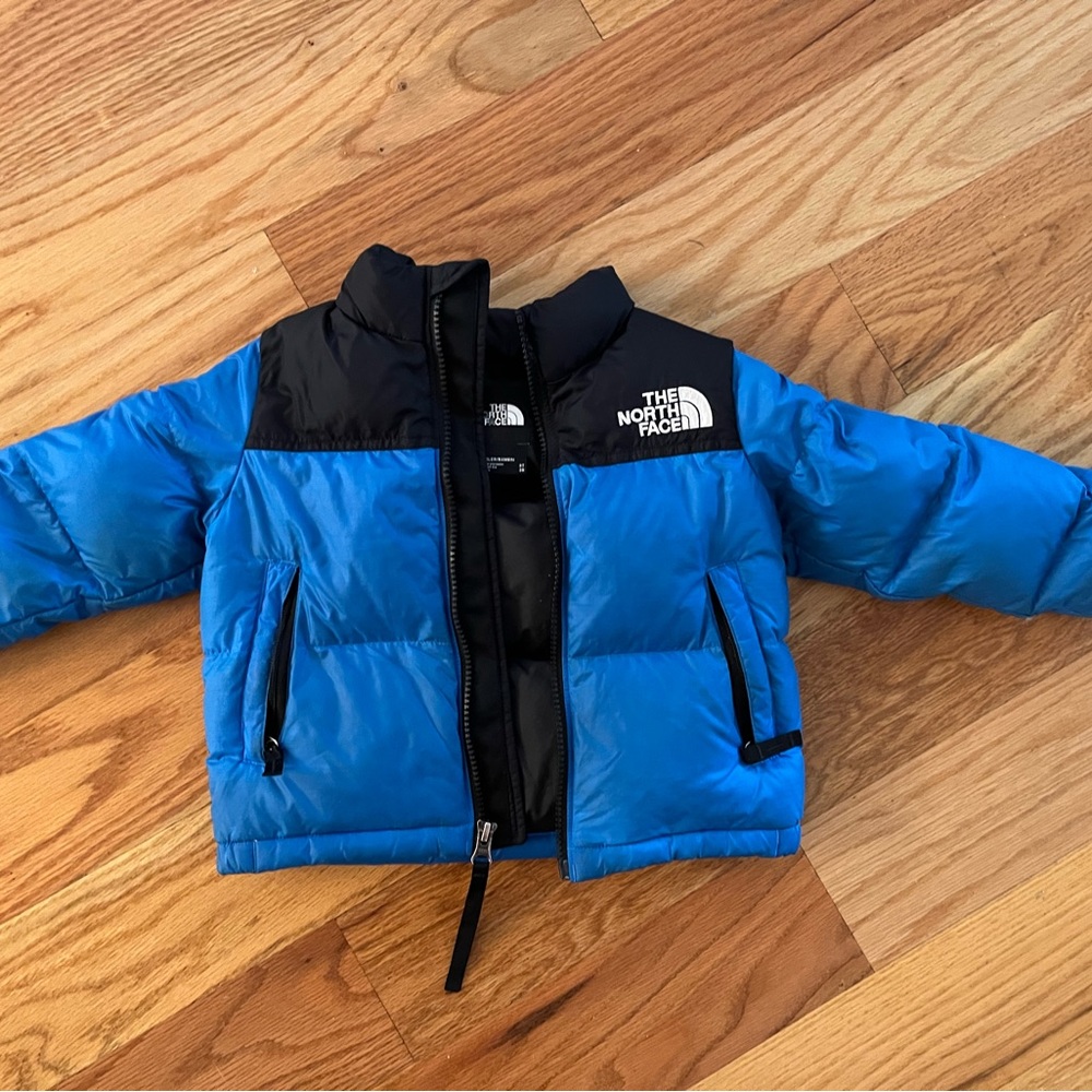 The North Face “1996 Retro Nuptse Jacket” in blue and black 2T